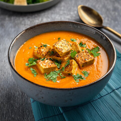 Warm Carrot Coconut Grilled Tofu Soup in Bowl