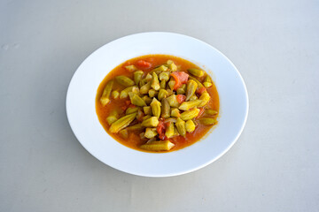 Bamya, Turkish traditional food. (Turkish cuisine) Homemade Food Okra in Plate. Organic Food. Etli bamya yemegi. 