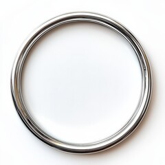 Silver Metal Ring: A close-up shot reveals a sleek, polished silver metal ring, its circular form highlighting its smooth texture and reflective surface.  The image is simple, clean.