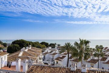 Photo from above of a typical small Spanish apartment block and Spanish homes and houses leading on...