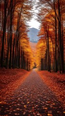 Fototapeta premium Autumnal road through vibrant forest.