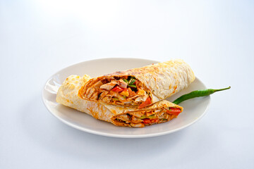 Lavash doner kebab ( soslu kasarli zurna doner durum )  or shawarma sliced in plate isolated.  Tavuk Et Doner Durum. Hatay Iskenderun usulu bazuka tavuk doner durum.