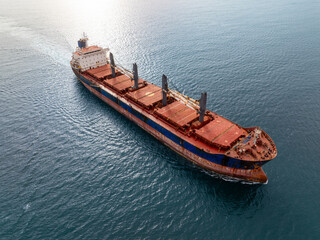 Aerial view of dry cargo ship. Bulk carrier cargo vessel. Ship logistic and transportation business...