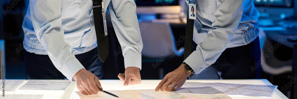 Leinwandbilder header of male and female military officers bending over table with paper documents while pointing a