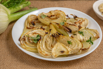 Grilled fennel on ceramic plate.