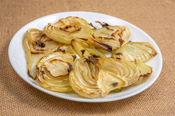 Oven baked fennel on ceramic plate.