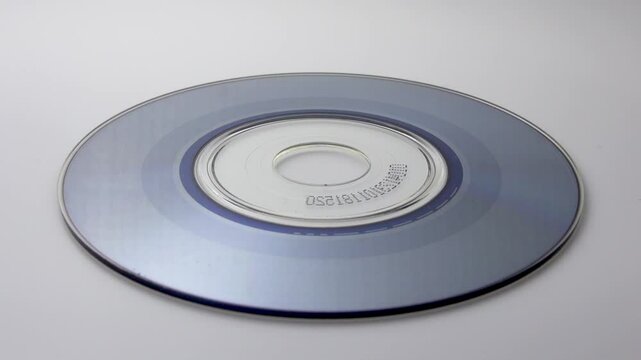 Spinning CD on white background