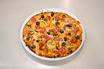 Traditional Turkish cuisine. Pizza, pita, pidesi, sucuk, hummus, kebab. Many dishes on the table. Serving dishes in restaurant. Margherita,  mix, formaggi, veggie karisik pizza. Top view, flat lay