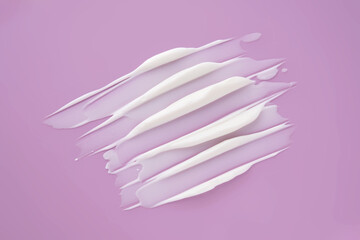 Swatch with white cream texture on a purple background.