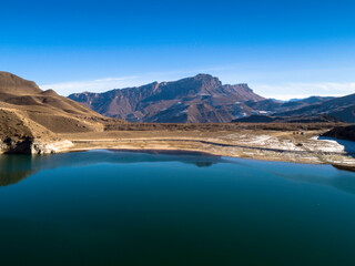 Beautiful aerial view of a mountain lake in a picturesque gorge. Landscape and nature of the North Caucasus