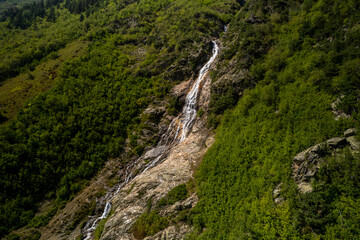 Beautiful view of a waterfall in the North Caucasus mountains. Landscape and nature of the North Caucasus