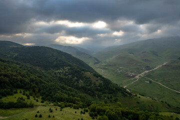 Fototapeta premium Aerial panorama overlooking mountain peaks. Landscape and nature of the North Caucasus