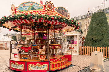 Geneva, Switzerland - Vintage traditional carousel (merry-go-round) at Noel Au Quai Christmas market in Geneva, Switzerland