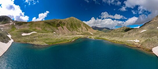 Mountain lake with blue water in a picturesque gorge. Landscape and nature of the North Caucasus