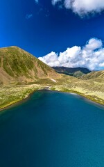 Mountain lake with blue water in a picturesque gorge. Landscape and nature of the North Caucasus
