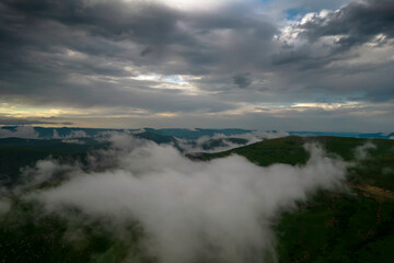 Mountains in the clouds, low clouds in a mountain valley. Landscape and nature of the North Caucasus