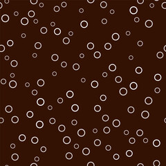 Seamless pattern with many random circles. White round element on dark brown background. Cute cozy design for textiles, wallpapers, etc. Minimalist geometric vector illustration