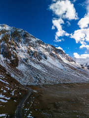 Beautiful aerial view of snowy peaks in a picturesque gorge. Landscape and nature of the North Caucasus
