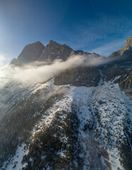 Mountains in the clouds, low clouds in a mountain valley. Landscape and nature of the North Caucasus