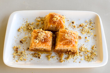 Turkish Dessert Sobiyet, havuc dilimi, midye baklava, mussels baklava and classic baklava with Pistachio . Cikolatali cevizli, fistikli soguk Baklava, top view.
