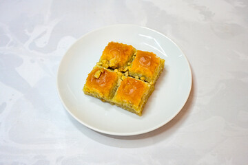 Turkish Dessert Sobiyet, havuc dilimi, midye baklava, mussels baklava and classic baklava with Pistachio . Cikolatali cevizli, fistikli soguk Baklava, top view.