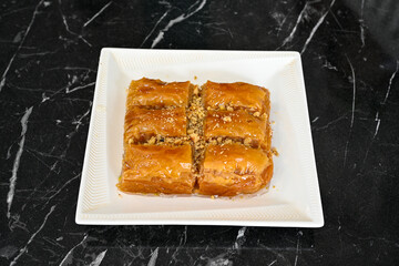 Turkish Dessert Sobiyet, havuc dilimi, midye baklava, mussels baklava and classic baklava with Pistachio . Cikolatali cevizli, fistikli soguk Baklava, top view.