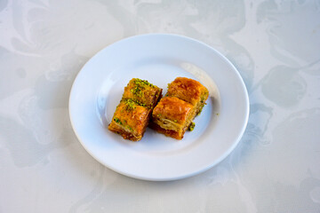 Turkish Dessert Sobiyet, havuc dilimi, midye baklava, mussels baklava and classic baklava with Pistachio . Cikolatali cevizli, fistikli soguk Baklava, top view.