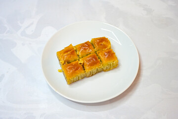 Turkish Dessert Sobiyet, havuc dilimi, midye baklava, mussels baklava and classic baklava with Pistachio . Cikolatali cevizli, fistikli soguk Baklava, top view.