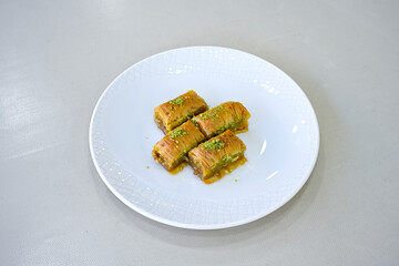 Turkish Dessert Sobiyet, havuc dilimi, midye baklava, mussels baklava and classic baklava with Pistachio . Cikolatali cevizli, fistikli soguk Baklava, top view.
