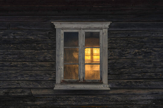 Windows of an old log house in the cultural landscape between Bilitt and Balke at Toten, Norway, in December 2024.