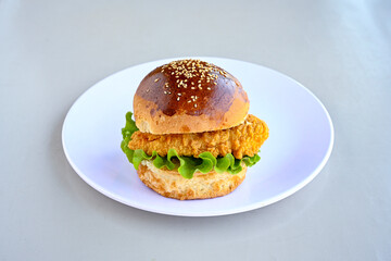 Big tasty burger with beef cutlet on a plate. Hamburger, cheeseburger with mushroom. Hamburger, Mexica, mushroom double cheddar  burger.  Crispy chicken burger. With french fries, patates kizartmasi.