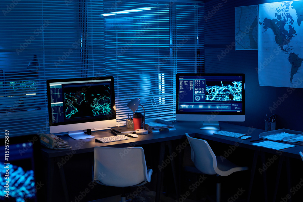 Leinwandbilder two desktop computers with graphic data standing on desks in dark office lit with blue light in mili