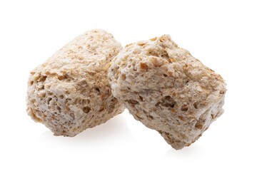 Two wheat bran granules isolated on white background, objects completely sharp
