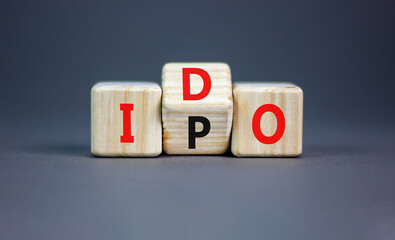 Initial public or DEX offering symbol. Concept words abbreviation IPO or IDO on wooden block....