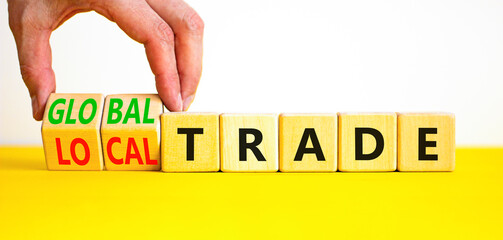 Global or local trade symbol. Concept words Global trade Local trade on beautiful wooden blocks. Beautiful white background. Businessman hand. Business Global or local trade concept. Copy space