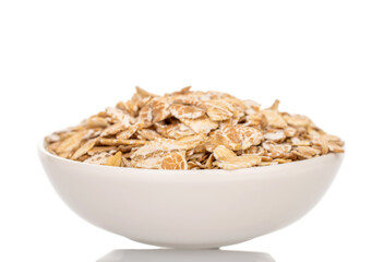 Oatmeal rolled with home kitchen utensils, close-up,  isolated on white background