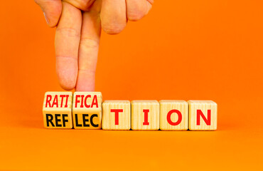 Ratification or reflection symbol. Concept words Ratification Reflection on wooden cubes. Beautiful orange background. Businessman hand. Business and ratification or reflection concept. Copy space.