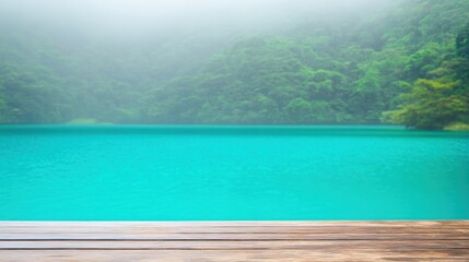Obraz premium Tranquil Lake Scene with Mist and Lush Greenery Surrounding Water