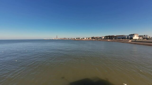 Time-lapse of seagulls swimming on the Irish Sea near the South Pier in Blackpool town, England, UK