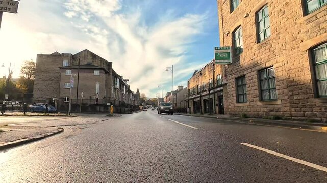 Driving through the Uppermill village, Greater Manchester, England, UK, on a sunny day