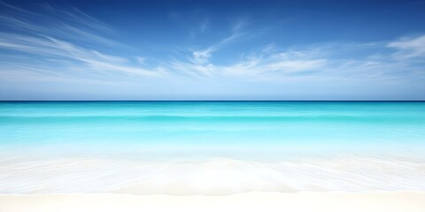 Fototapeta premium A serene beach with crystal-clear turquoise water, gentle waves, and a clear blue sky with wispy clouds. Concept Serene Beach, Crystal-Clear Water, Gentle Waves, Blue Sky, Wispy Clouds