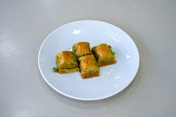 Turkish Dessert Sobiyet, havuc dilimi, midye baklava, mussels baklava and classic baklava with Pistachio . Cikolatali cevizli, fistikli soguk Baklava, top view.