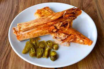 Lavash doner kebab ( soslu kasarli zurna doner durum )  or shawarma sliced in plate isolated.  Tavuk Et Doner Durum. Hatay Iskenderun usulu bazuka tavuk doner durum.