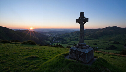 Celtic cross at sunset overlooking green hills, St. Patrck's day concept