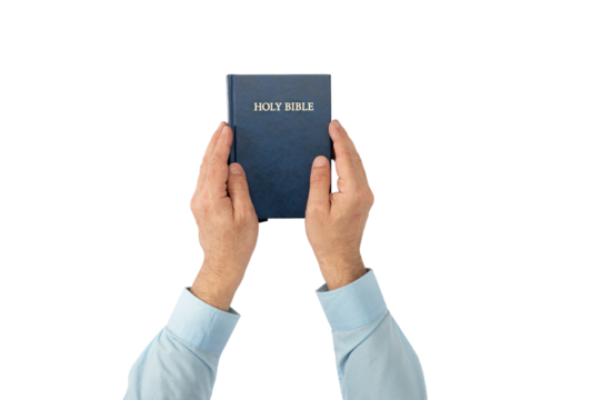 Hands holding Holy Bible book. Sacred scripture. Isolated background
