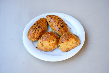 Turkish pastry product , tasty pogaca. Simit, gevrek. Turkish Pastries; peynirli, patatesli, kasarli pogaca, borek, acma, ay coregi at patisserie showcase.