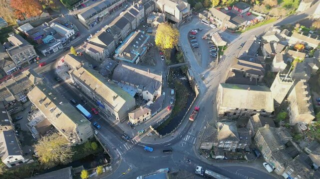 Aerial footage of the center of Holmfirth town on a sunny day, West Yorkshire, England, UK