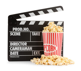 Tasty popcorn and movie clapper isolated on white