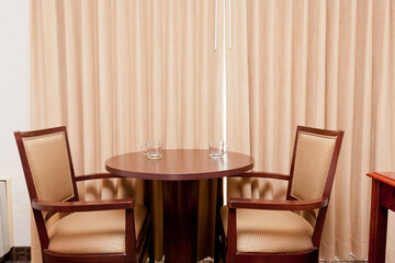 two chairs around a round table