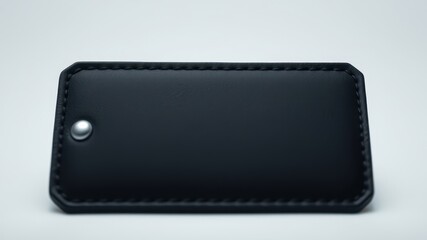 High-quality black leather key holder with stitched edges and a metal button